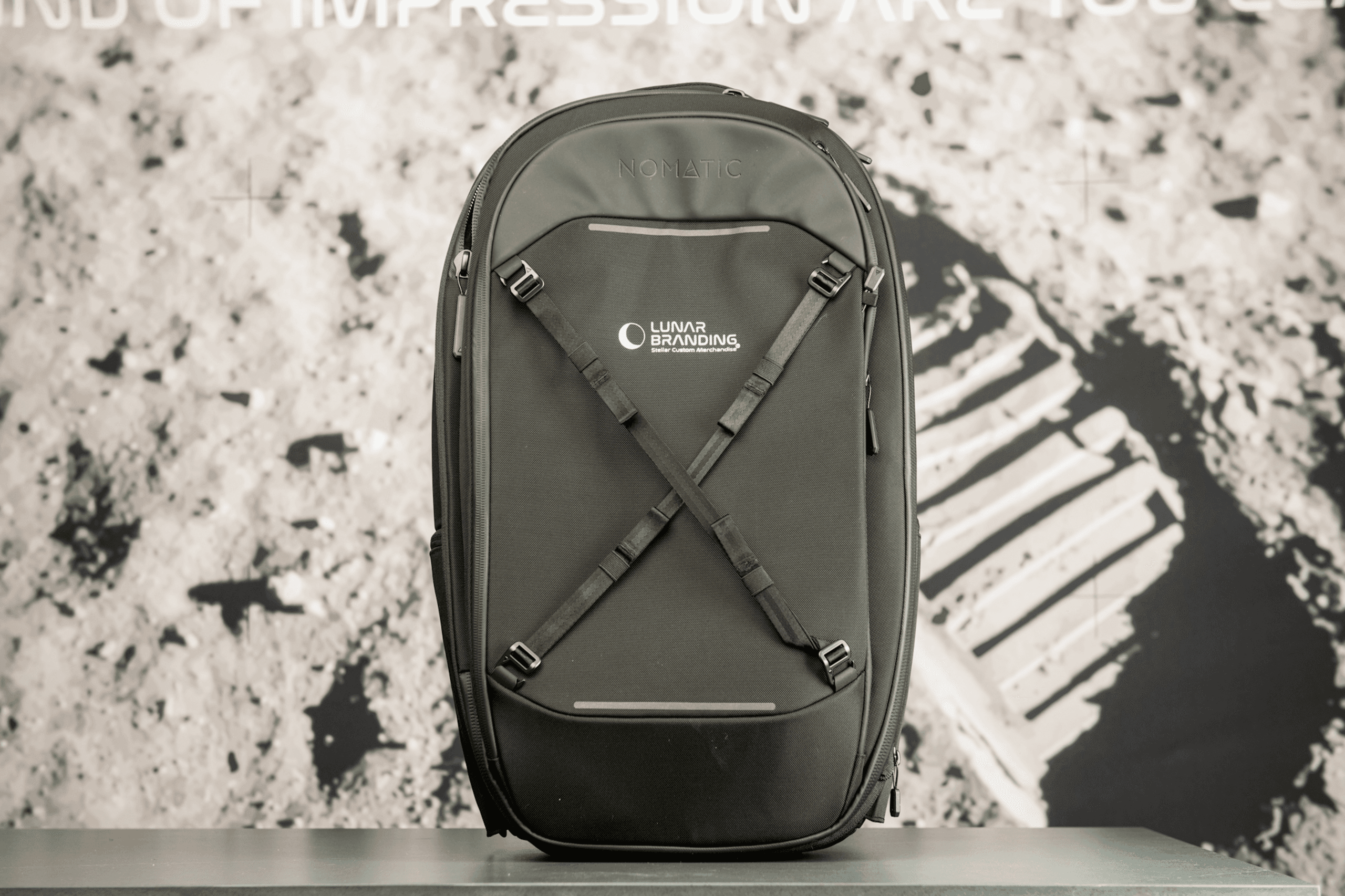 Olive green NOMATIC backpack with custom logo